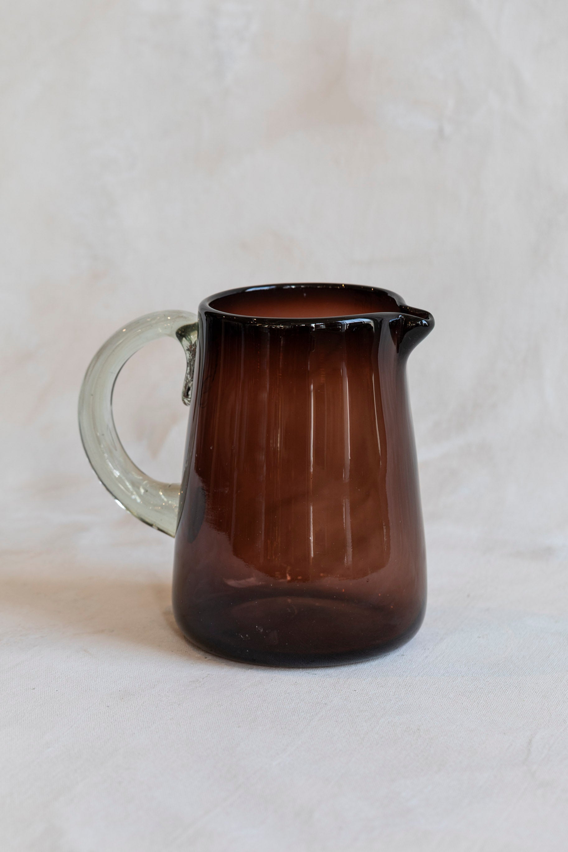 handblown_glass_pitcher_tamarind-3_e951621f-57b3-40f0-af75-64488bc0f0d5.jpg