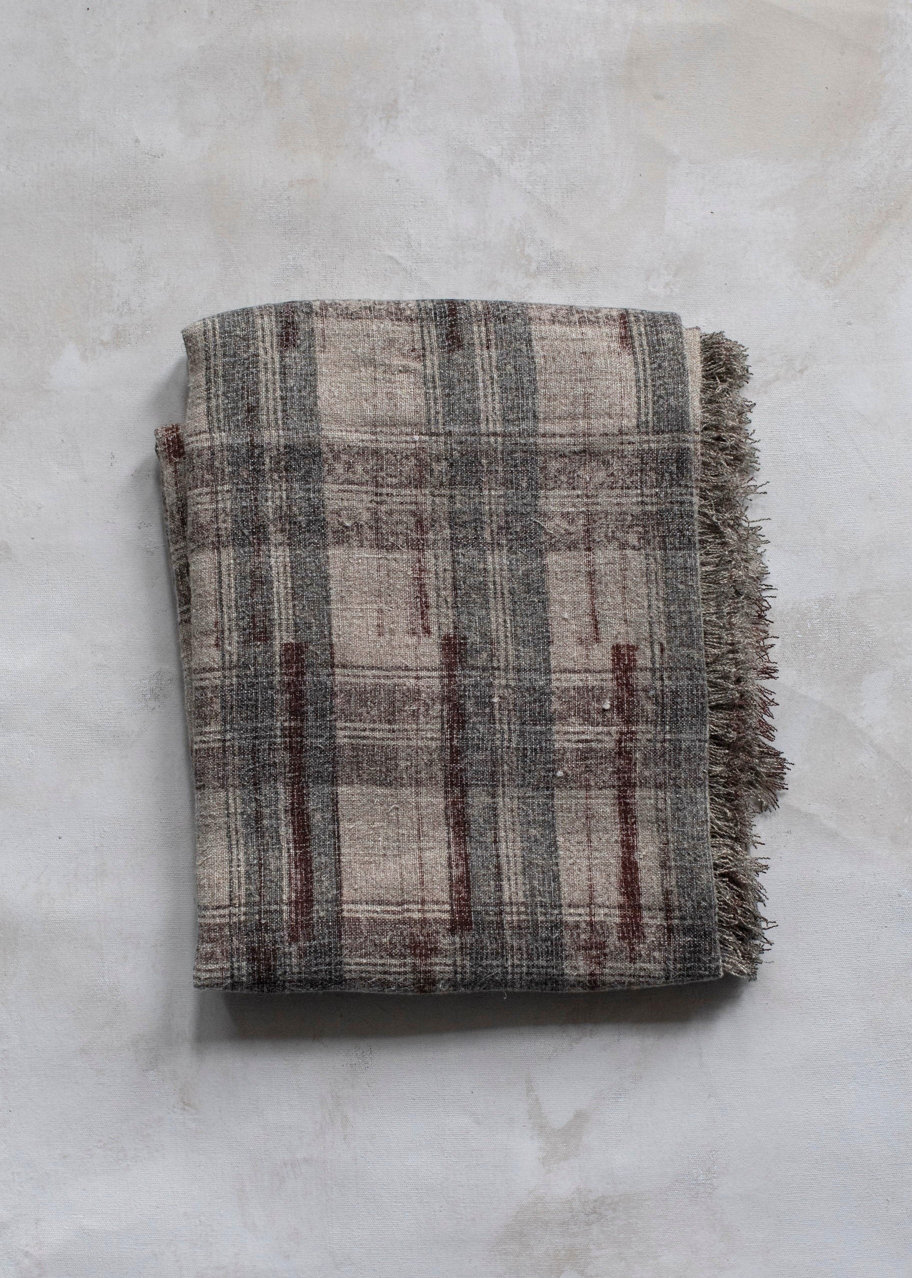 Hoppe Shoppe vintage linen throw blanket in purple and grey plaid with hand block-printed details and frayed edges.
