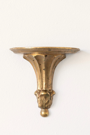 Hoppe Shoppe vintage brass wall shelf with ornate fluted corbel, leaf carvings, and a warm aged patina.