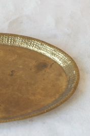 Hoppe Shoppe vintage large oval brass tray with a textured basketweave rim and warm aged patina finish.