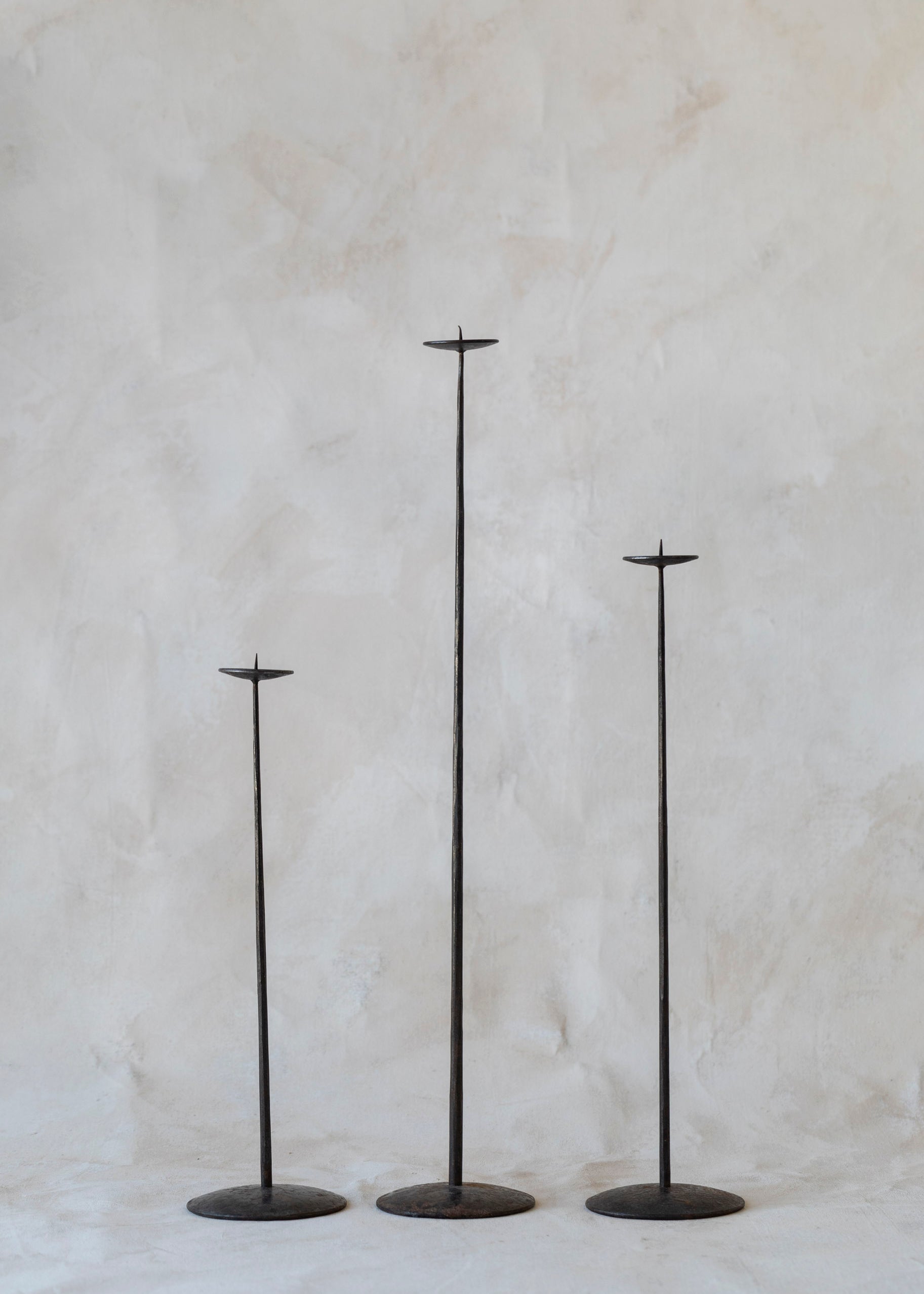 vintage_extra_tall_trio_iron_candlestick.jpg