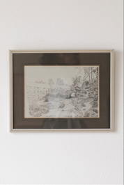 Hoppe Shoppe vintage pencil drawing of a stone bridge and thatched cottages in a decorative frame on a white wall.