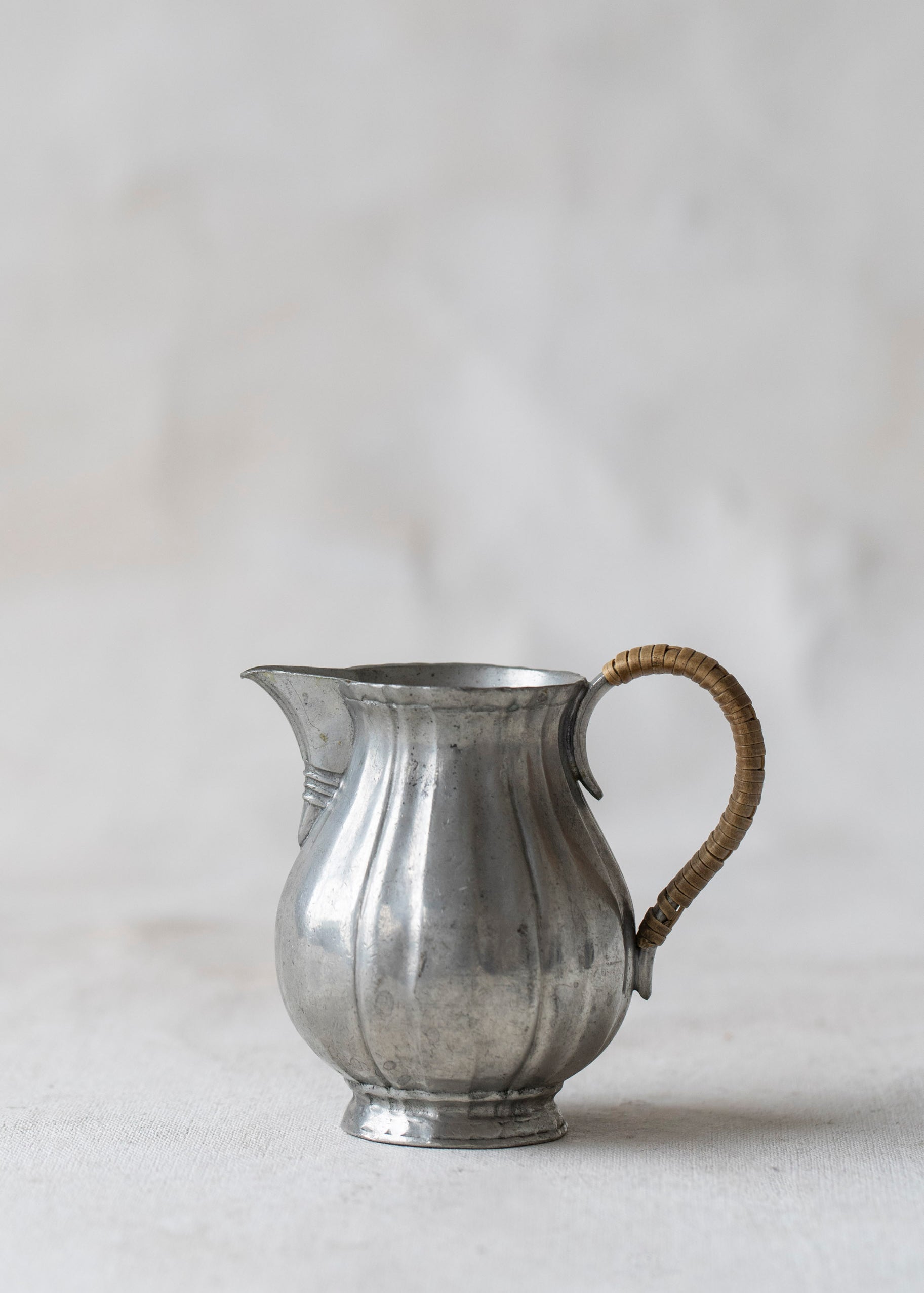 vintage_silver_rattan_wrapped_creamer_pitcher.jpg