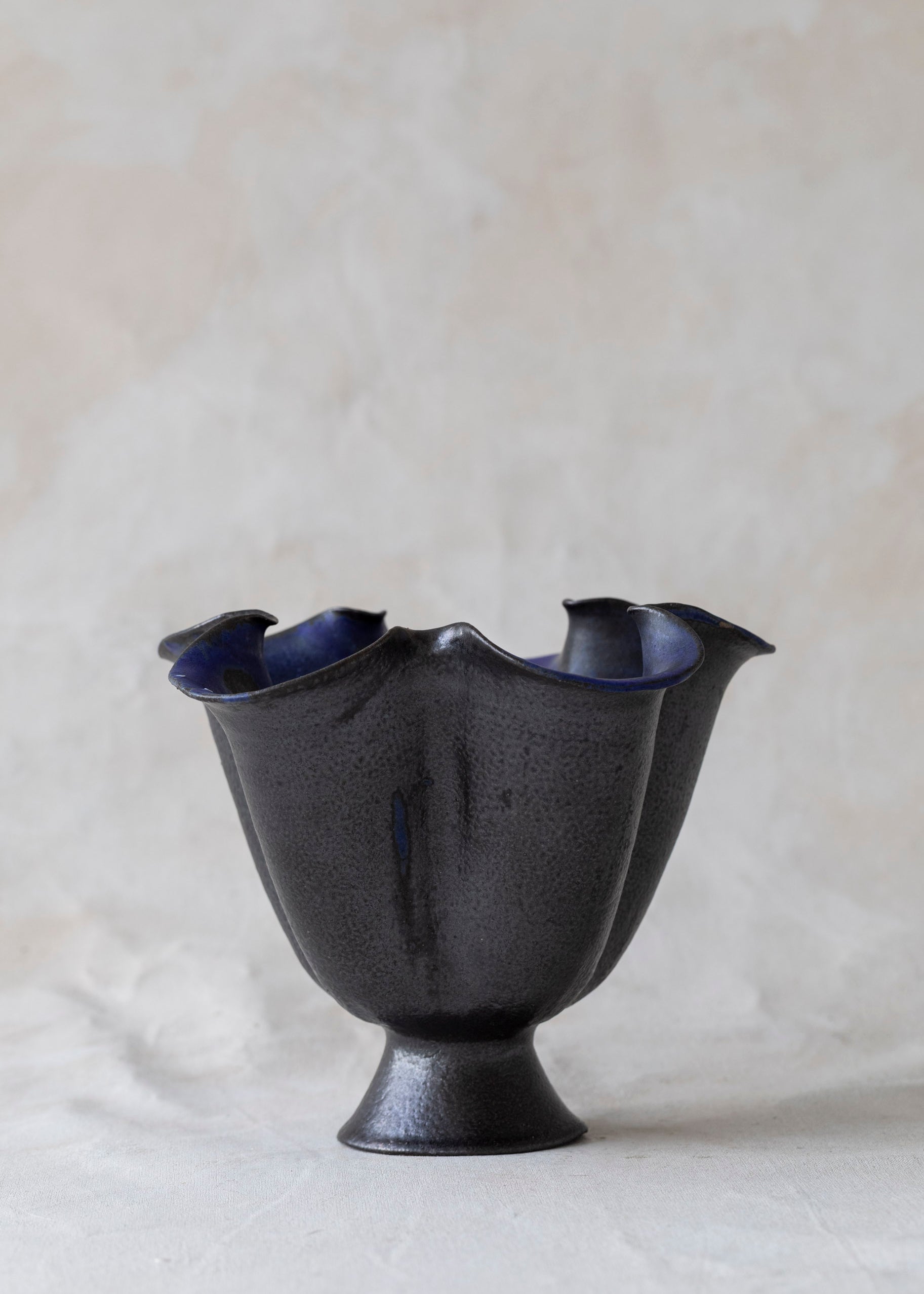 vintage_wavy_black_ceramic_blue_pedestal_bowl.jpg